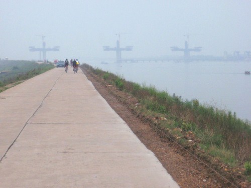 We are cycling on top of a flood dyke wall.